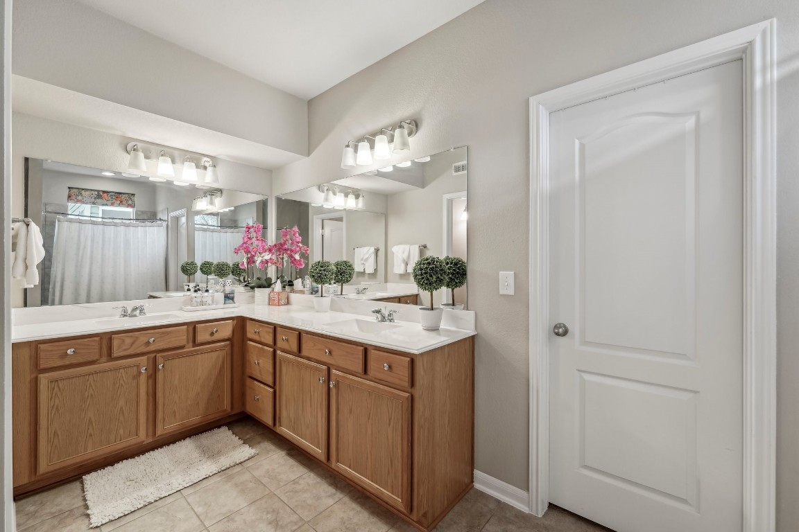 1373 Nevarez Kyle, TX 78640 - Photo 16 of 39 a bathroom with a sink and a mirror