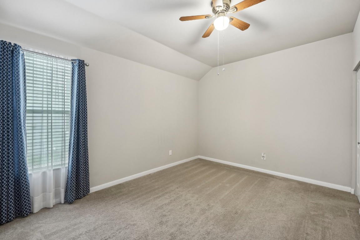 1373 Nevarez Kyle, TX 78640 - Photo 22 of 39 a view of a room with a ceiling fan and a window