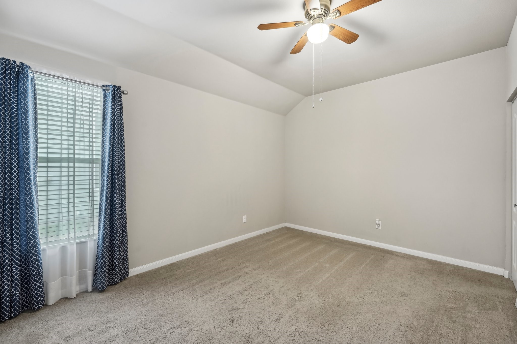1373 Nevarez Kyle, TX 78640 - Photo 22 of 38 a view of a room with a ceiling fan and a window
