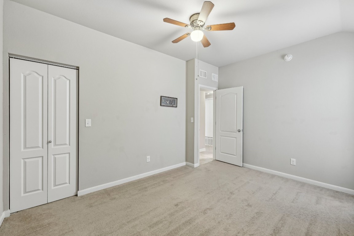 1373 Nevarez Kyle, TX 78640 - Photo 23 of 39 an empty room with closet and a ceiling fan