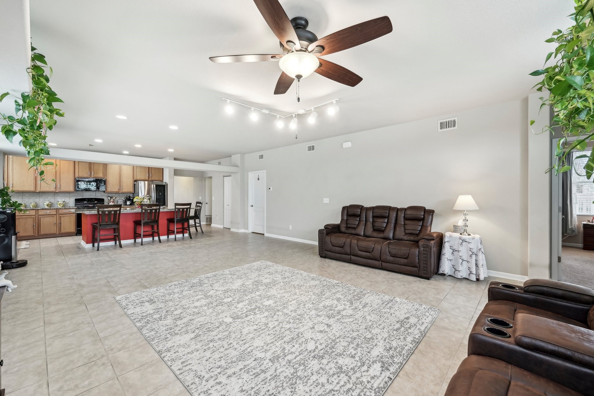 1373 Nevarez Kyle, TX 78640 - Photo 6 of 38 a room with lots of furniture and a flat screen tv