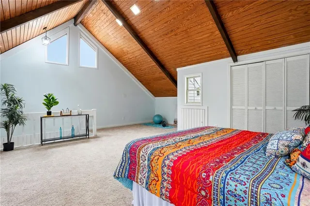 a bed sitting in a bedroom next to a house