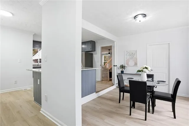 a view of a dining room with furniture and window
