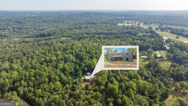 an aerial view of house with outdoor space