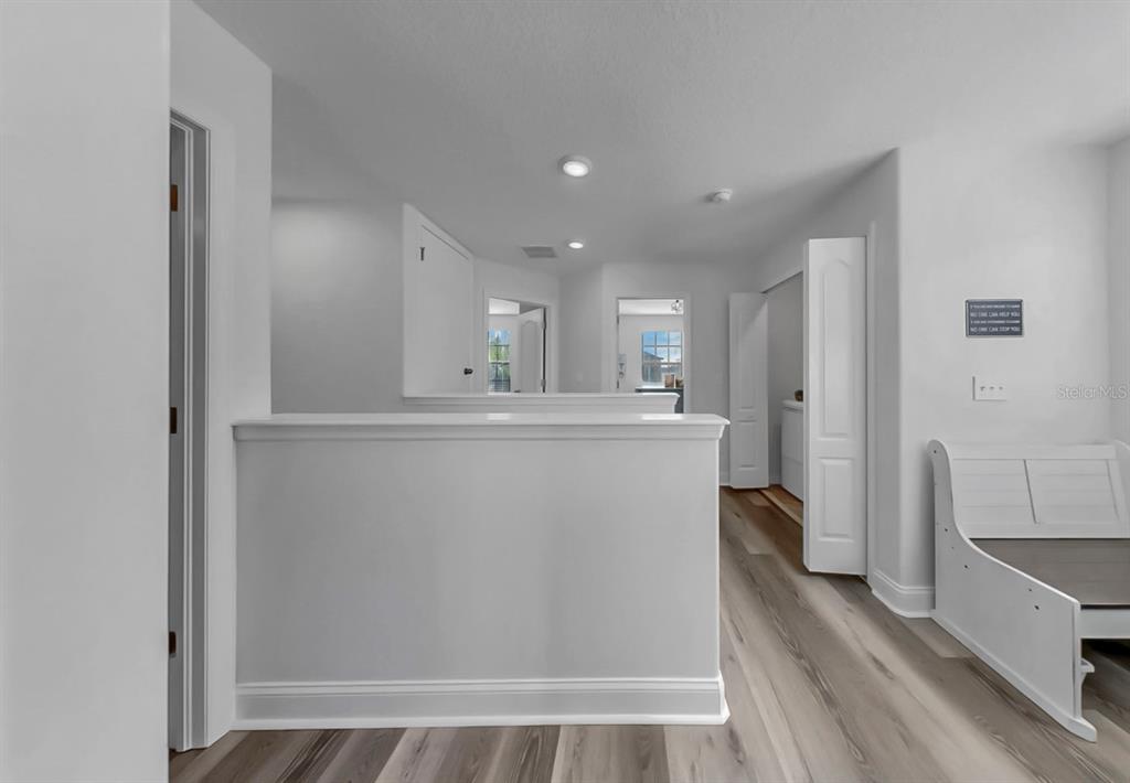 10136 Newminster Loop Ruskin, FL 33573 - Photo 15 of 64 a view of a kitchen from the hallway