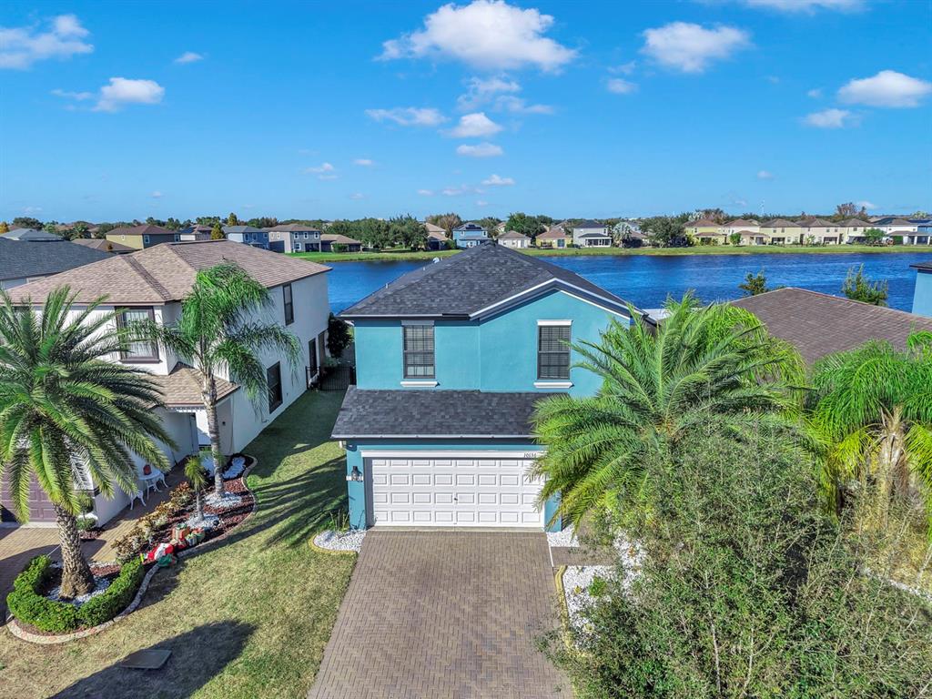 10136 Newminster Loop Ruskin, FL 33573 - Photo 18 of 64 a view of houses with an outdoor space and lakeside