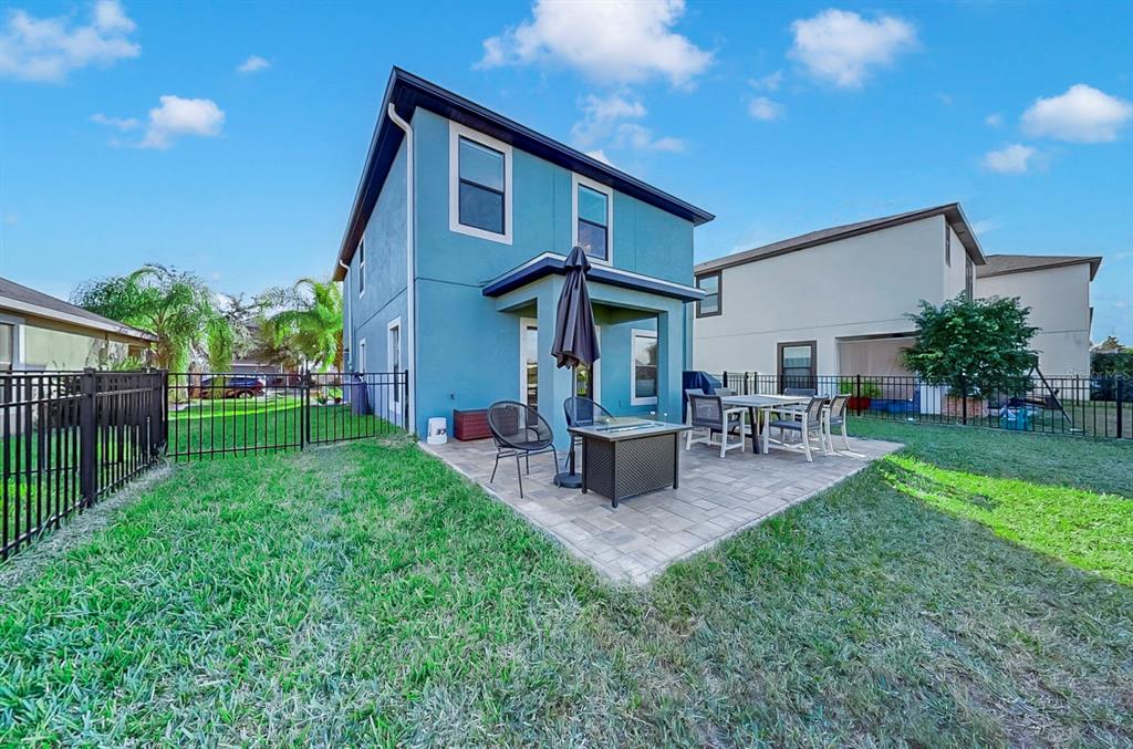 10136 Newminster Loop Ruskin, FL 33573 - Photo 28 of 64 a view of a house with backyard and sitting area