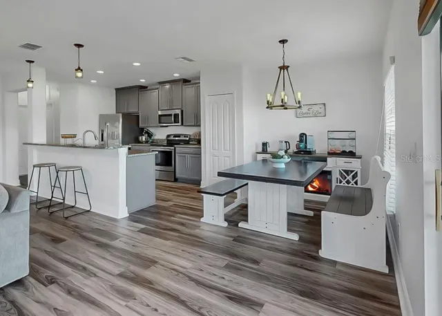 a living room with furniture and flat screen tv