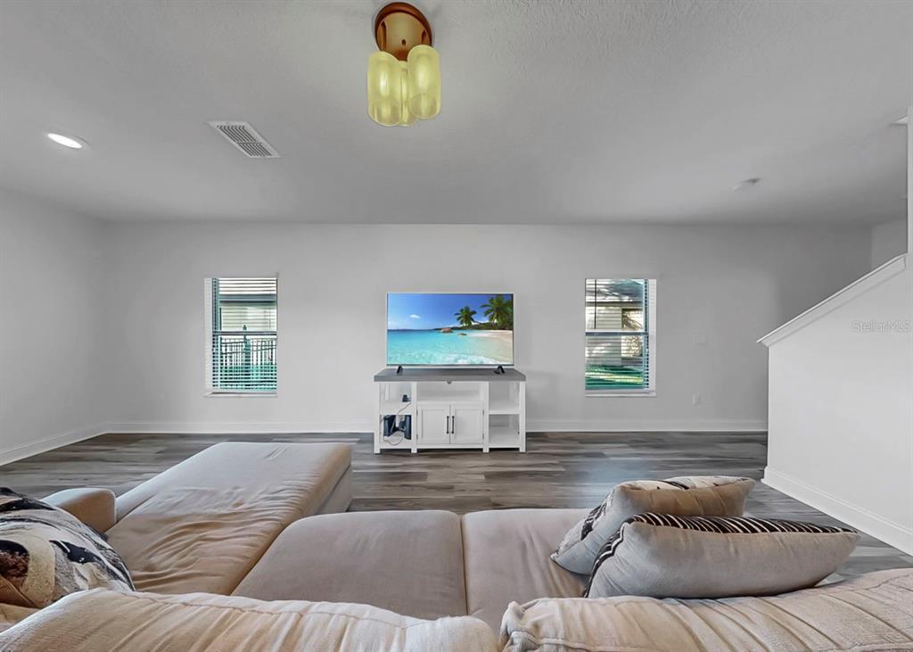 10136 Newminster Loop Ruskin, FL 33573 - Photo 48 of 64 a living room with furniture and window
