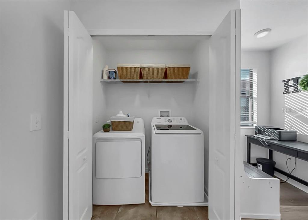 10136 Newminster Loop Ruskin, FL 33573 - Photo 8 of 64 a utility room with dryer and washer