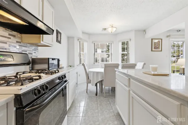 a kitchen with a stove and a sink
