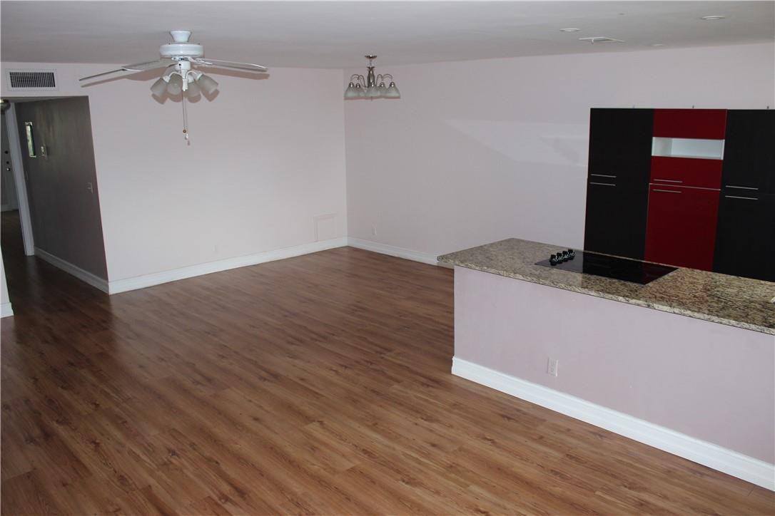 5433 Lakefront Boulevard, Unit B Delray Beach, FL 33484 - Photo 4 of 18 ALL LAMINATE WOOD FLOORING.