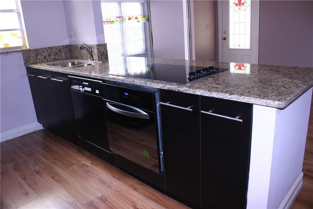 5433 Lakefront Boulevard, Unit B Delray Beach, FL 33484 - Photo 6 of 18 NEW GRANITE COUNTER TOP AND OVEN.