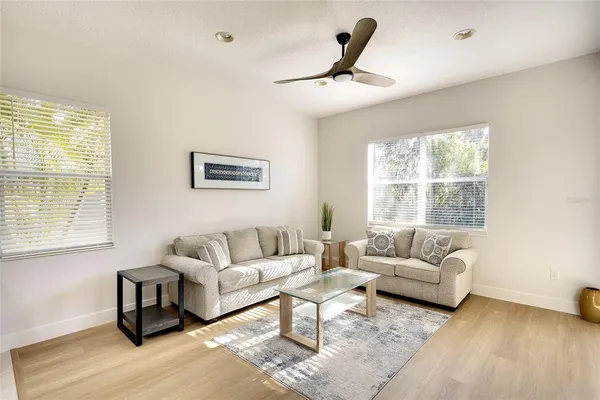 a living room with furniture and a window