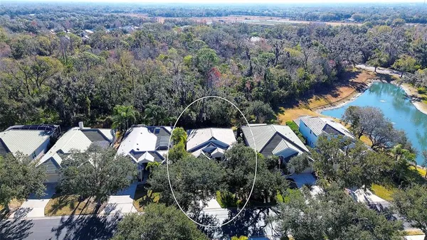 an aerial view of multiple house with yard