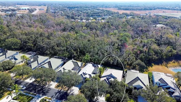 an aerial view of a house with a yard