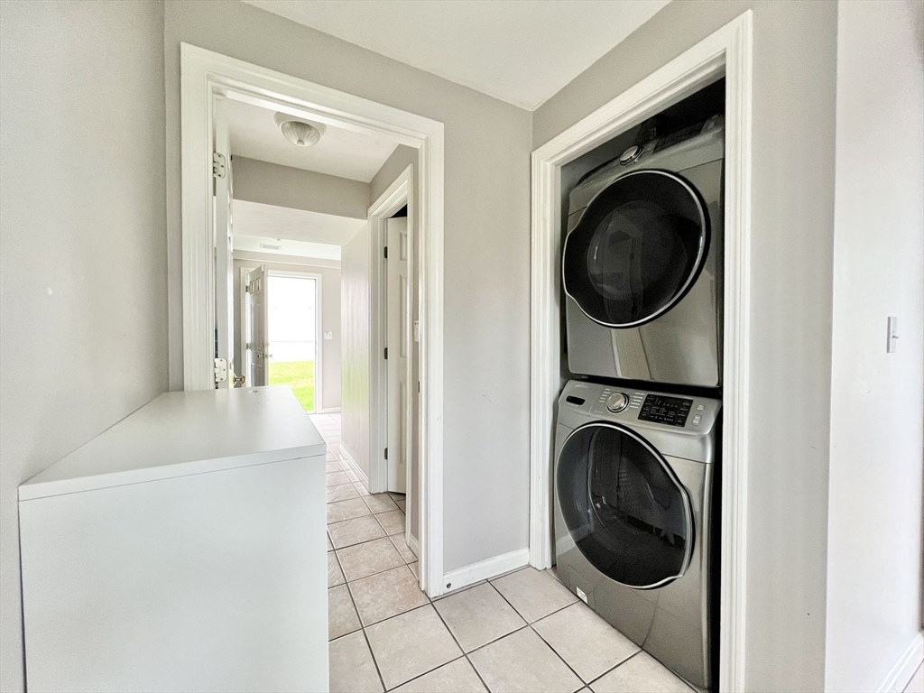 1005 Trapelo Road, Unit 3 Waltham, MA 02452 - Photo 15 of 19 a view of a hallway with washer and dryer