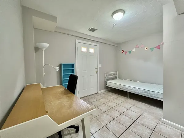 a view of a room with furniture and wooden floor