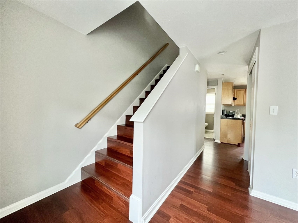 1005 Trapelo Road, Unit 3 Waltham, MA 02452 - Photo 7 of 19 a view of entryway and hall with wooden floor