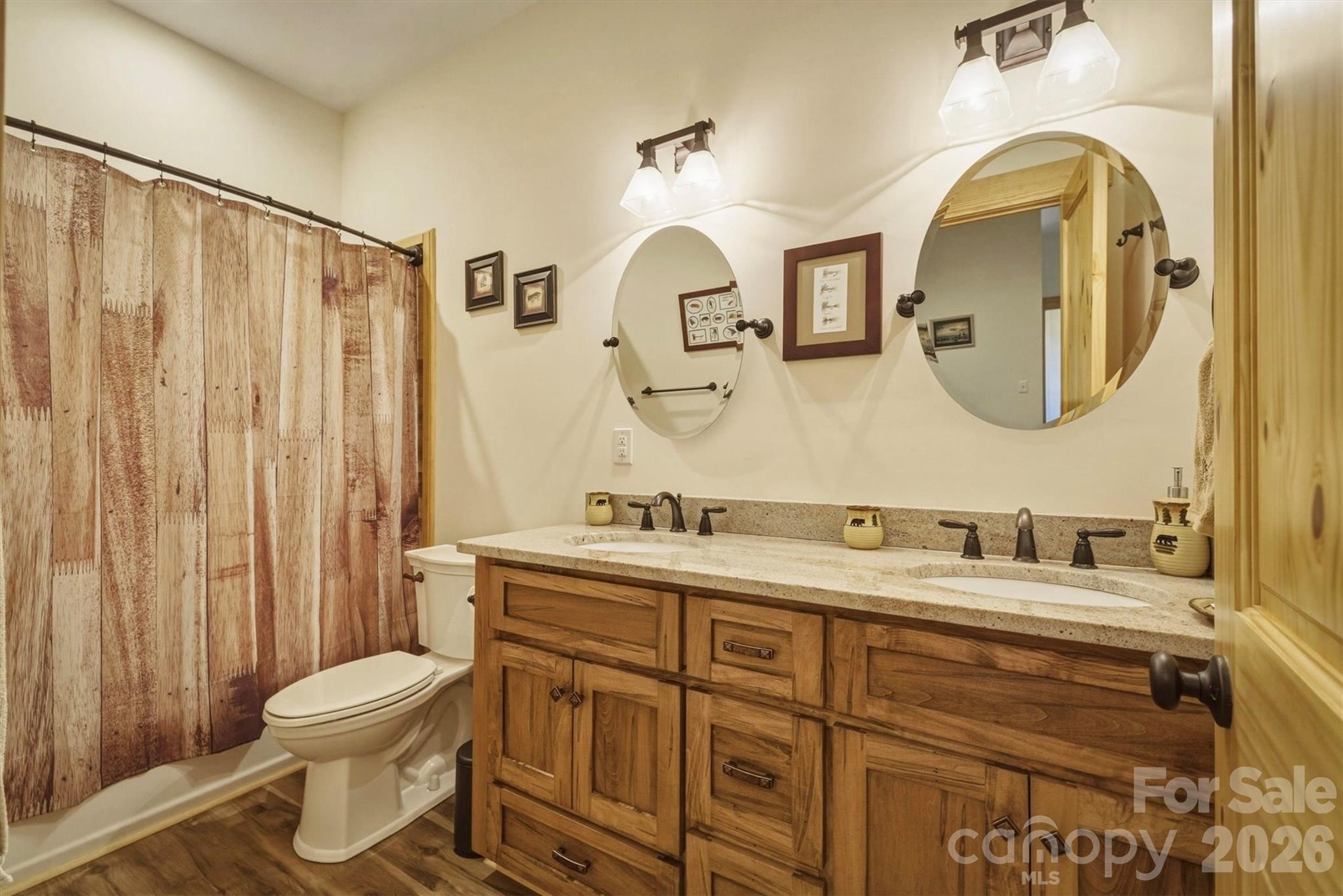 5564 Table View Lane Lenoir, NC 28645 - Photo 25 of 48 a bathroom with a toilet sink and mirror