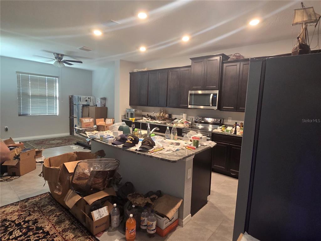 5846 Southwest 80th Lane Ocala, FL 34476 - Photo 11 of 27 a room with a table chairs and workspace