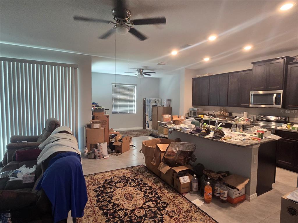 5846 Southwest 80th Lane Ocala, FL 34476 - Photo 12 of 27 a living room with lots of furniture and a view of kitchen