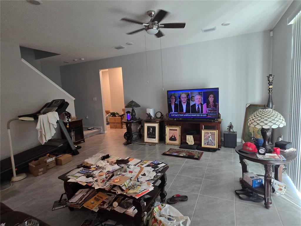 5846 Southwest 80th Lane Ocala, FL 34476 - Photo 13 of 27 a living room with furniture and a flat screen tv