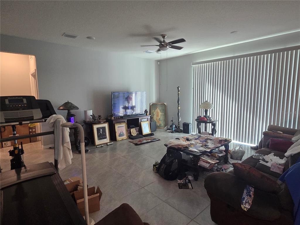 5846 Southwest 80th Lane Ocala, FL 34476 - Photo 15 of 27 a room with furniture or couch and a window