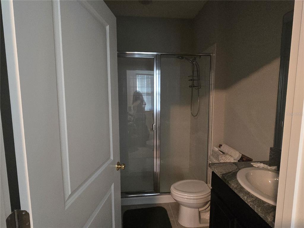 5846 Southwest 80th Lane Ocala, FL 34476 - Photo 18 of 27 a bathroom with a granite countertop toilet and a sink