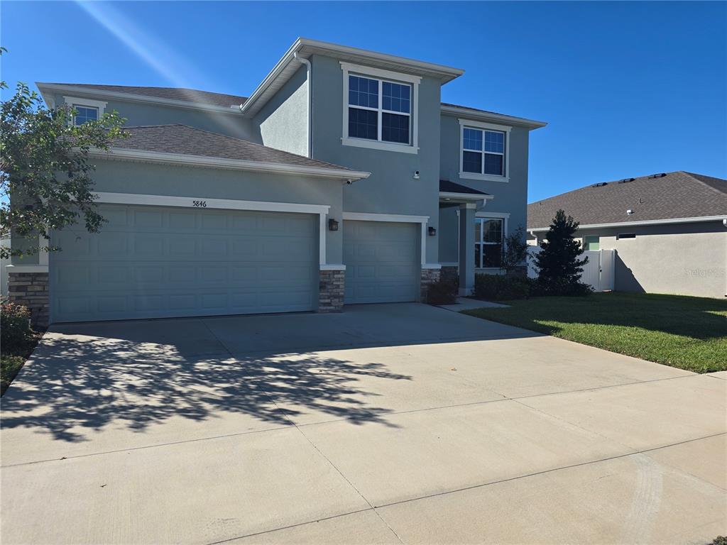 5846 Southwest 80th Lane Ocala, FL 34476 - Photo 2 of 27 a view of a house with a yard