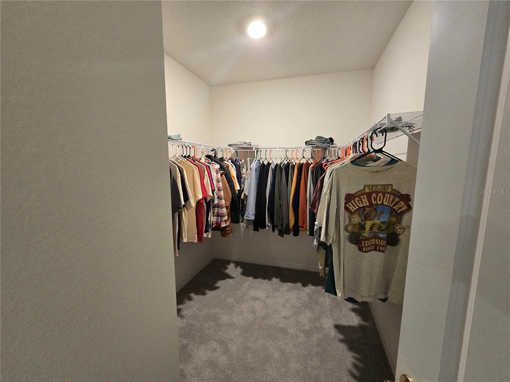 5846 Southwest 80th Lane Ocala, FL 34476 - Photo 27 of 27 a view of walk in closet with clothes
