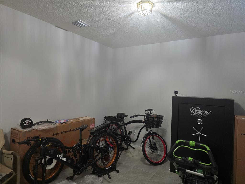 5846 Southwest 80th Lane Ocala, FL 34476 - Photo 8 of 27 a view of a bike storage and utility room with two washing machine