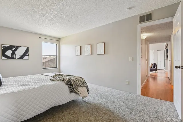 a bedroom with a bed and a table