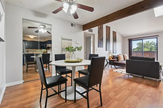 a view of a dining room with furniture window and wooden floor
