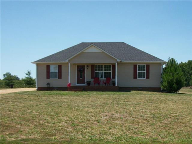5 Myrick Road Flintville, TN 37335 - Photo 1 of 13 a front view of a house with a garden