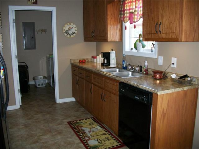5 Myrick Road Flintville, TN 37335 - Photo 6 of 13 a kitchen with a sink stove and cabinets
