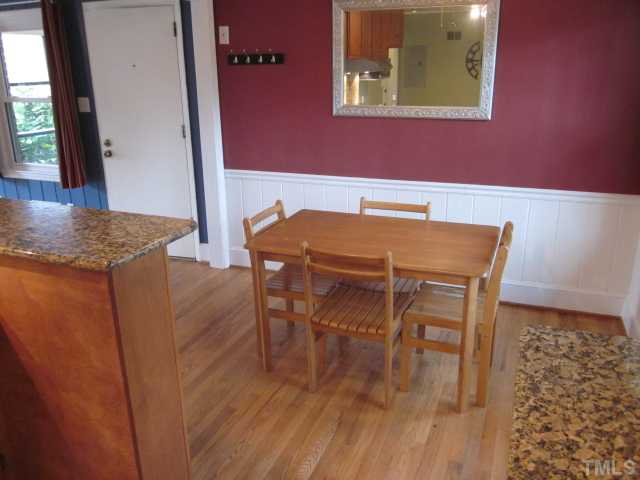 5316 Barclay Drive Raleigh, NC 27606 - Photo 12 of 25 Great view of the nice breakfast area! Features include hardwood floors, crown & chair rail moldings, original wainscoting and ceiling fan!