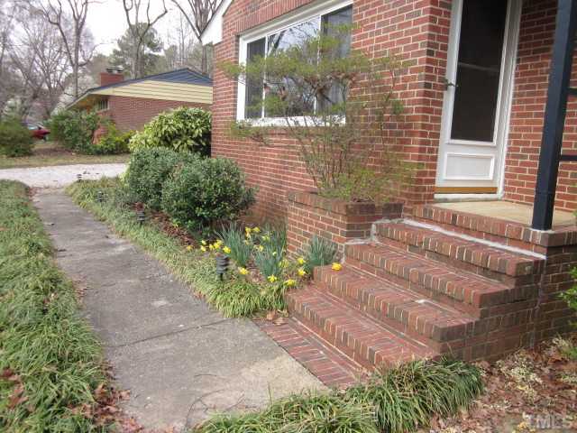 5316 Barclay Drive Raleigh, NC 27606 - Photo 5 of 25 Another great view of the covered front porch entry with sidewalk leading to front door from driveway! Great brick ranch home on a nice large lot with mature trees and fenced in backyard!