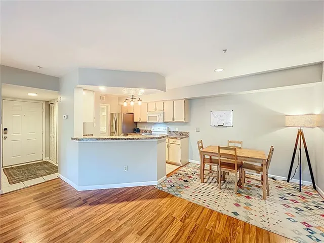 a living room with furniture rug and a window