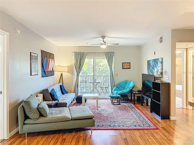 a bed room with a bed and glass windows
