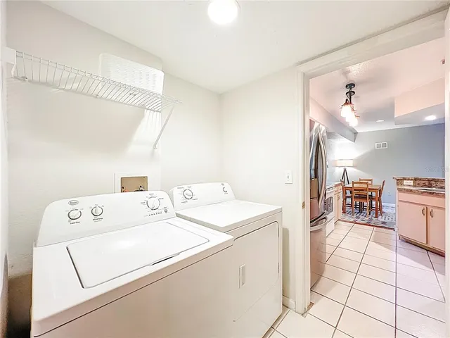 a balcony with wooden floor and outdoor seating
