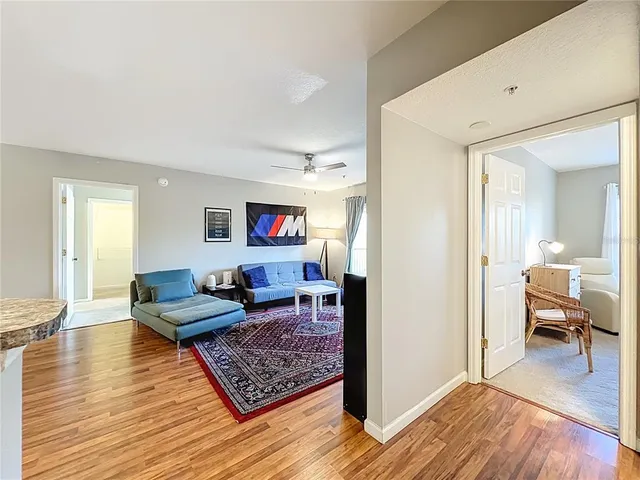 a large living room with stainless steel appliances granite countertop furniture and a kitchen view