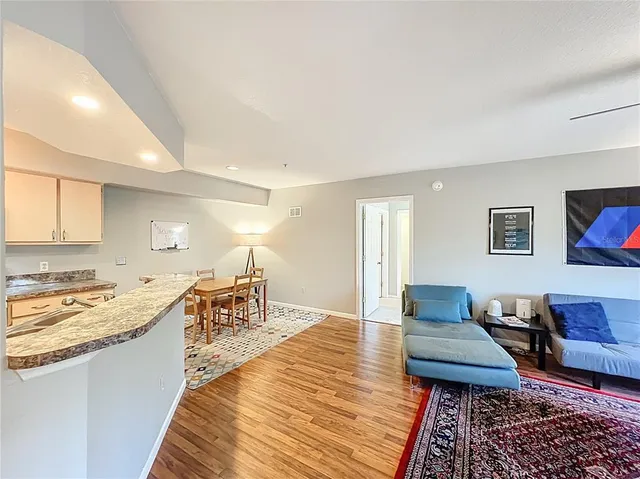 a kitchen with a sink stove and refrigerator