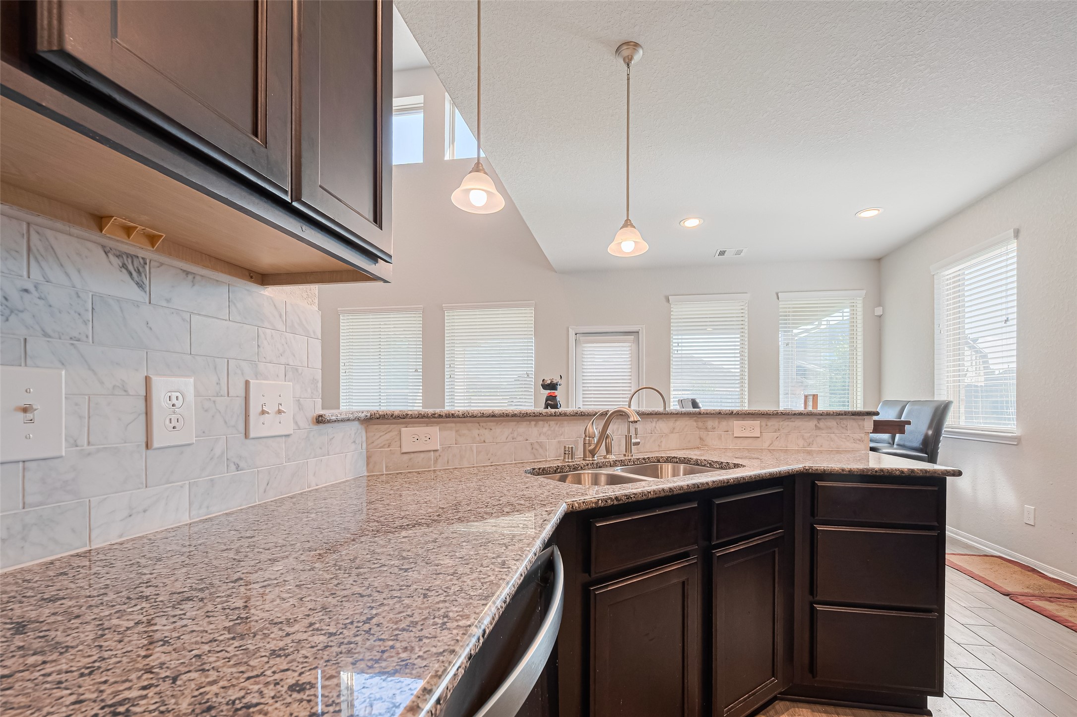 4507 Shallow Hill Court Houston, TX 77084 - Photo 16 of 50 a kitchen with granite countertop a sink a stove and cabinets
