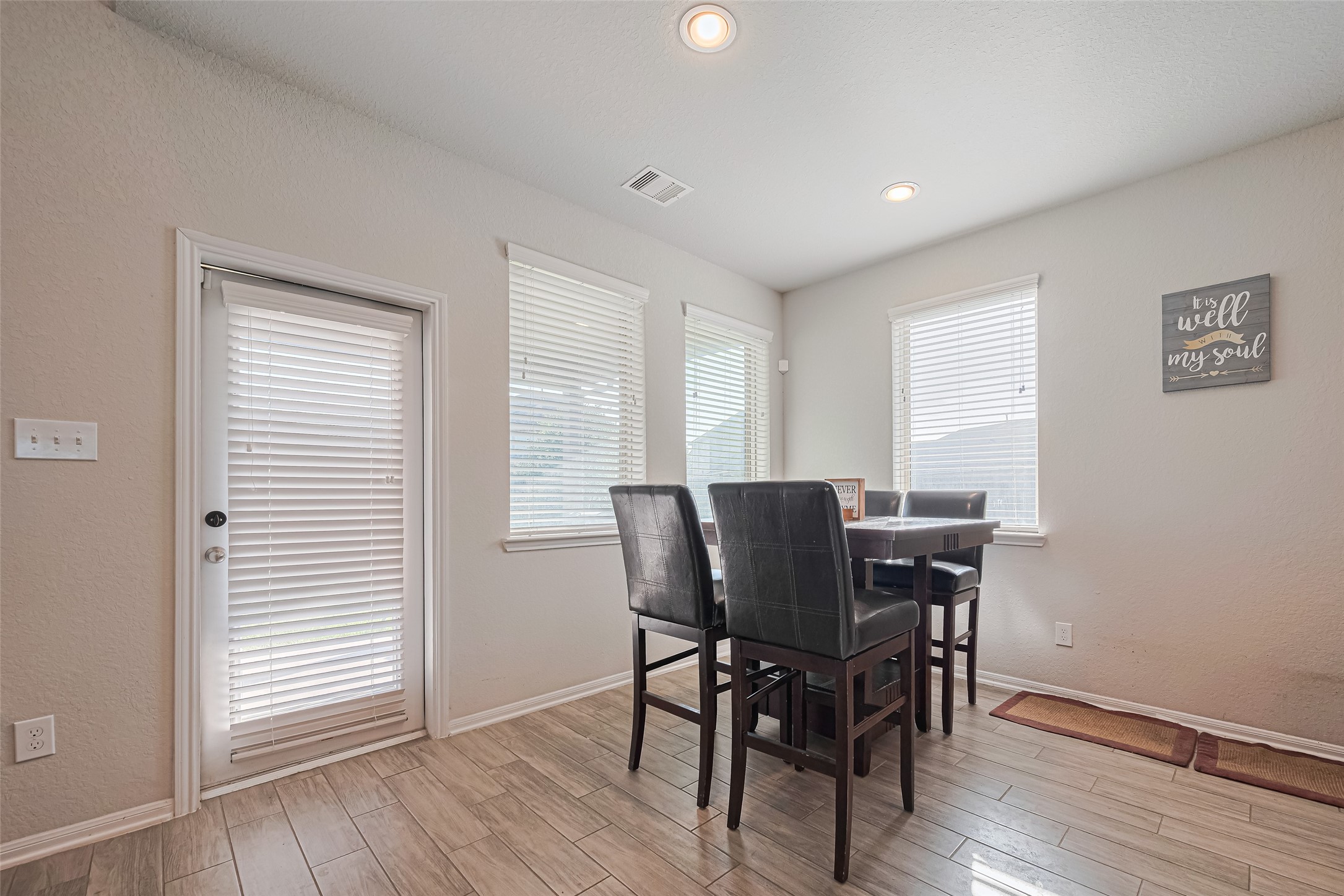4507 Shallow Hill Court Houston, TX 77084 - Photo 18 of 50 a view of a dining room with furniture and wooden floor