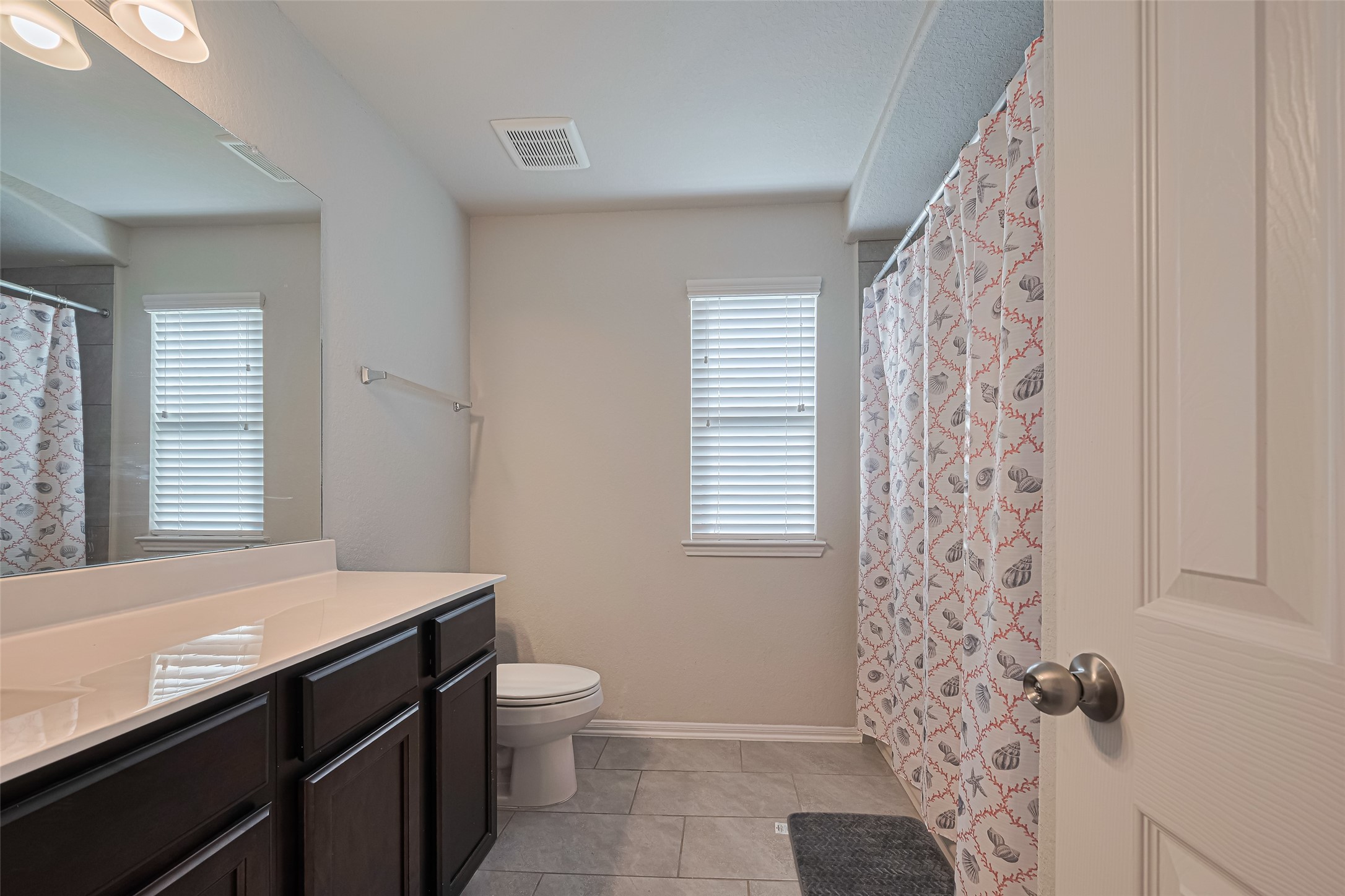 4507 Shallow Hill Court Houston, TX 77084 - Photo 26 of 50 a bathroom with a granite countertop sink a toilet and shower