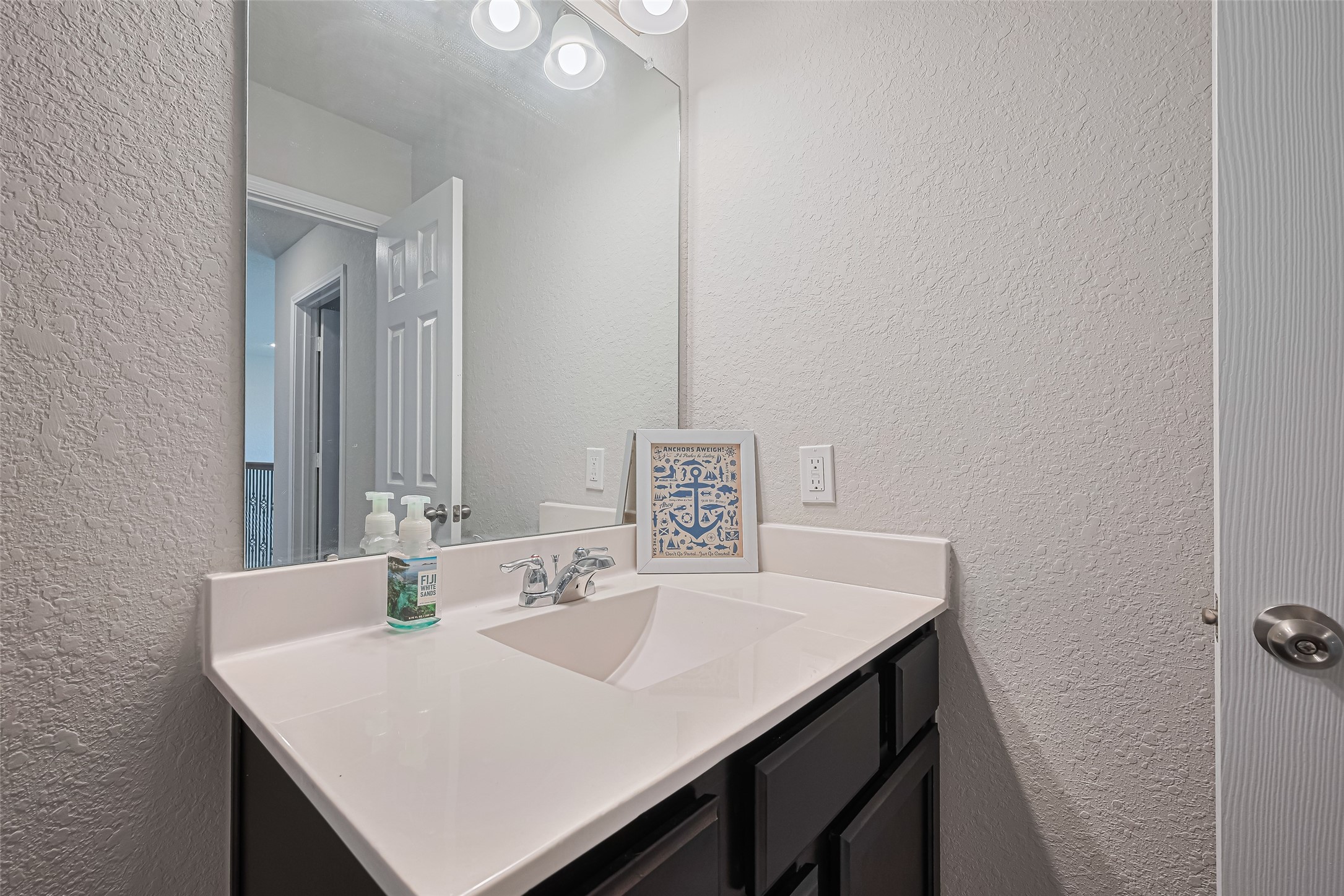 4507 Shallow Hill Court Houston, TX 77084 - Photo 31 of 50 a bathroom with a sink a vanity and a mirror