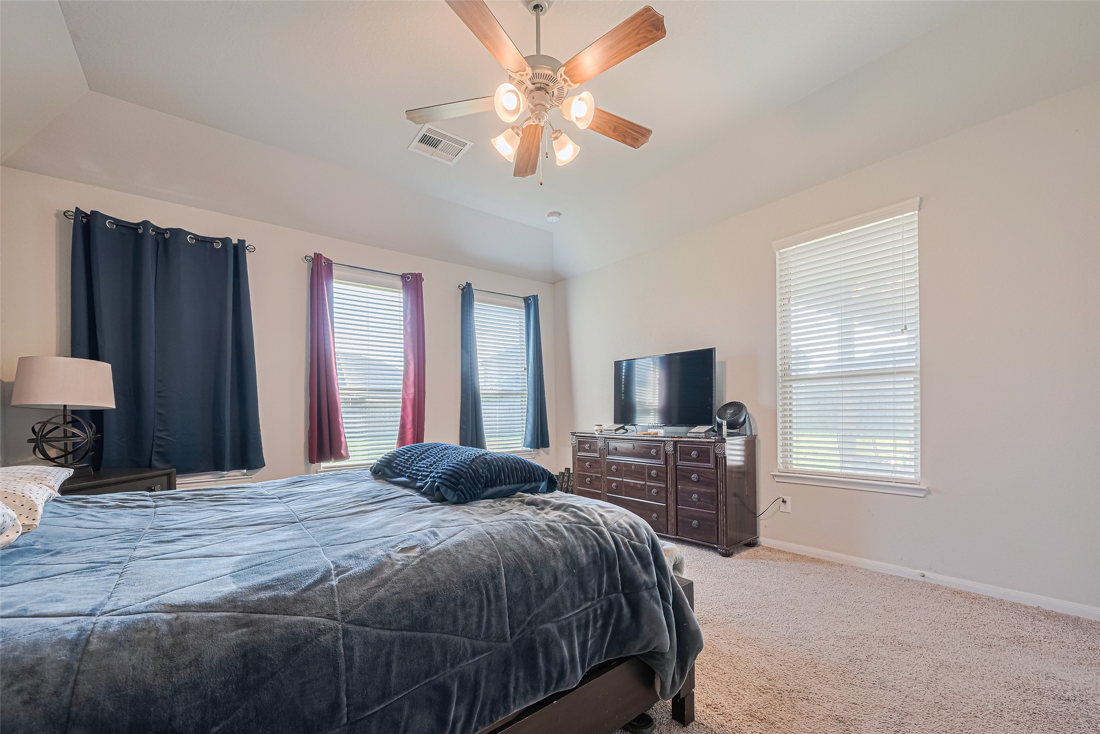 4507 Shallow Hill Court Houston, TX 77084 - Photo 34 of 50 a bedroom with a bed and a flat screen tv