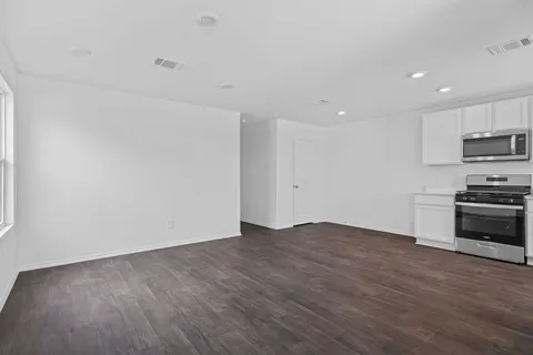 a view of kitchen with microwave and stove