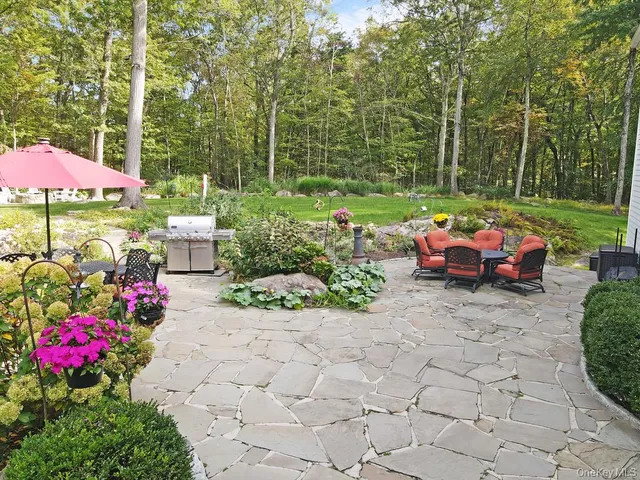 a view of a with chairs and table in the patio